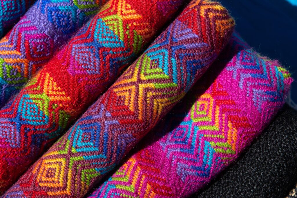 Closeup shot of rolled fabrics with colorful and unique designs