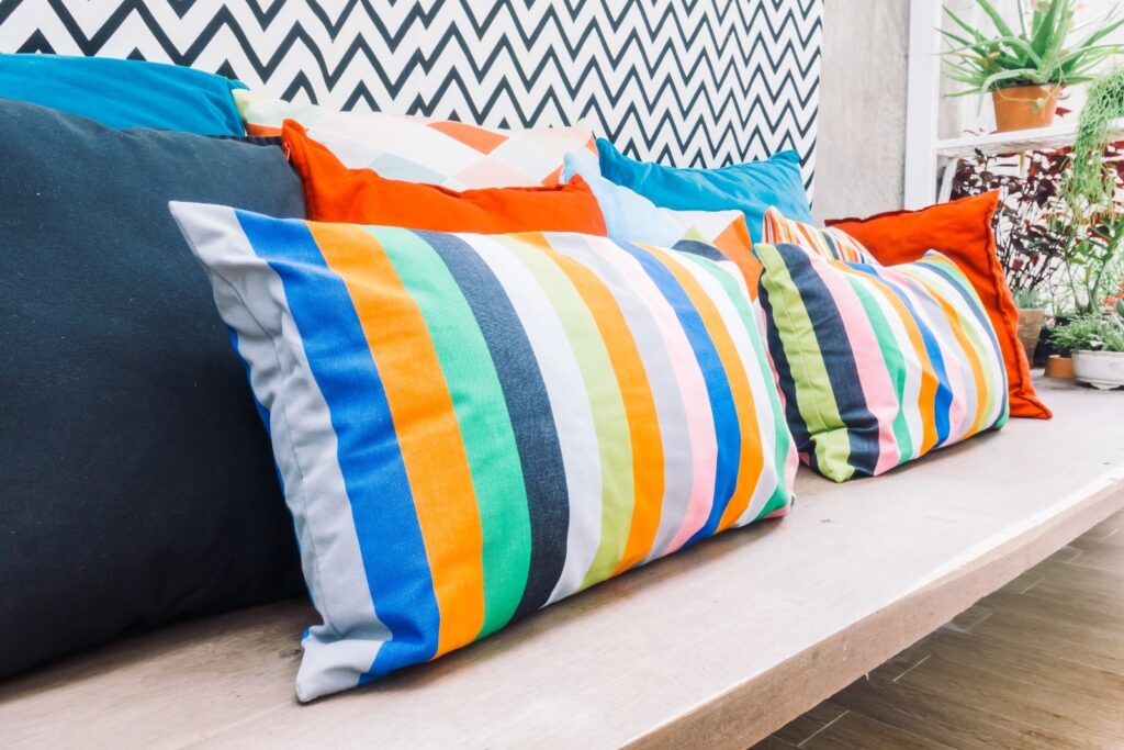 Monsoon Decor Ideas ,Colorful cushions and throws on a sofa. 