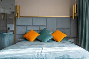 A colorful handwoven tapestry hanging on a bedroom wall.