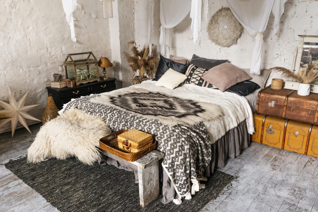  A cozy bohemian home decor bedroom with a colorful Indian dhurrie rug in the center.