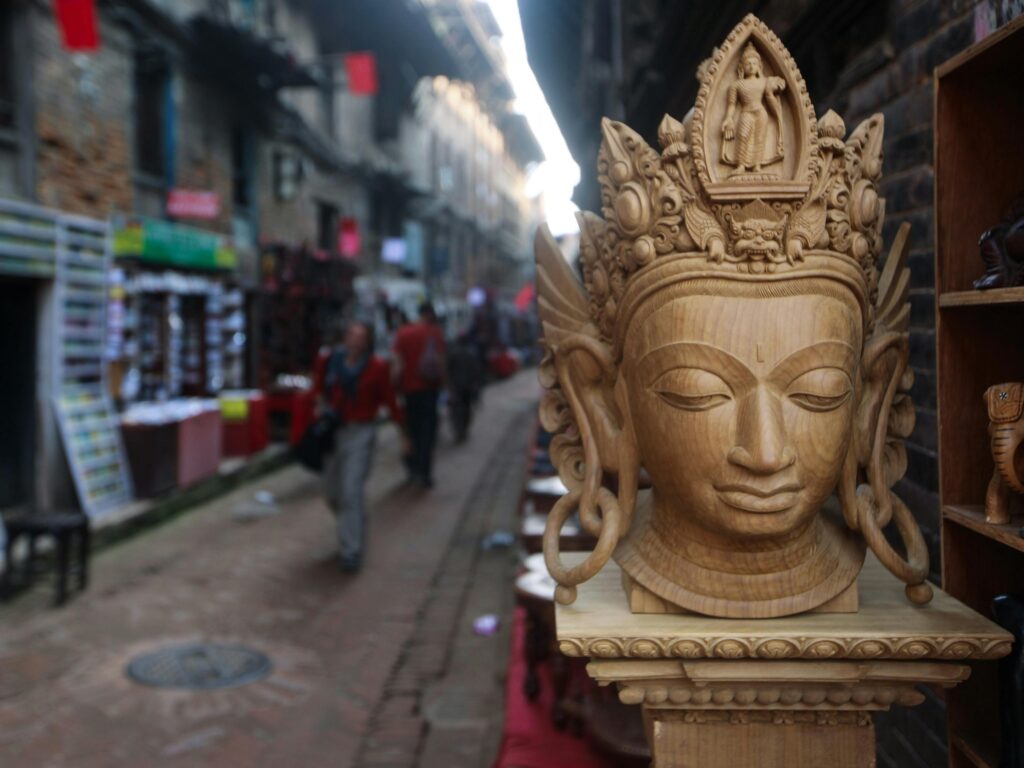 a wood carved statue of devi