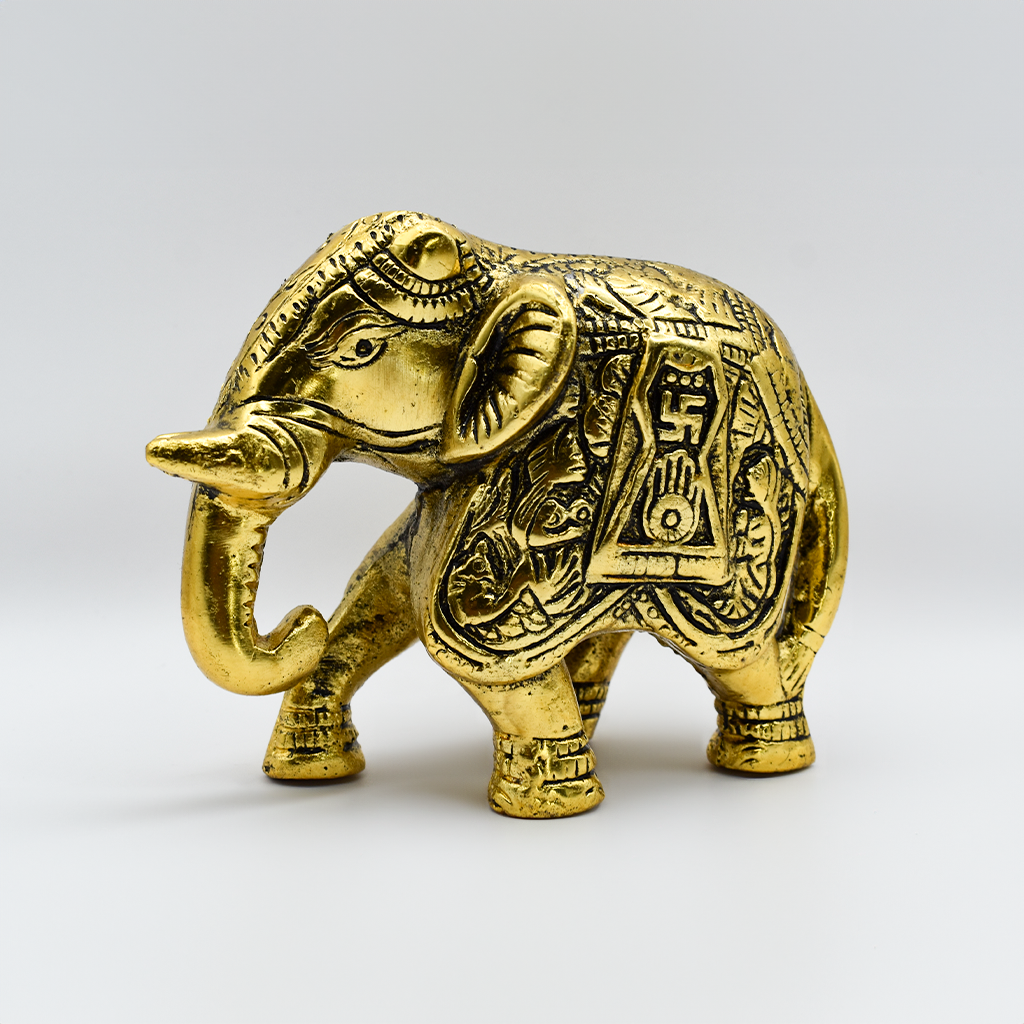 Golden Heritage Elephant statue - intricately detailed, gold-finished decorative piece symbolizing Indian craftsmanship, strength, wisdom, and good fortune.