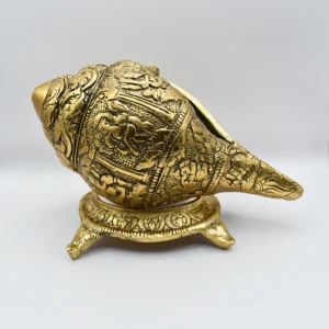 Ornate Golden Shankh with intricate golden embellishments, symbolizing Indian cultural heritage and craftsmanship.