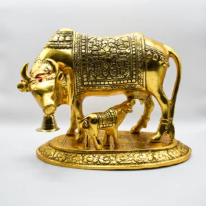 Golden Kamdhenu statue for table decor.