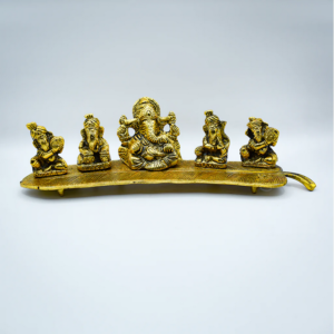 "Quintet of golden Ganesha idols seated on a banana leaf, symbolizing prosperity and wisdom."