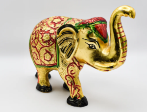 Set of three golden elephant figurines with colorful decorations