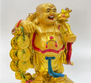 laughing buddha with coins at tanutra