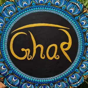 Dot Mandala Ghar Plate showcases the ancient art of dot painting, a technique that requires immense precision and creativity. Each dot is meticulously painted by hand to create stunning mandala patterns that radiate harmony and positivity. The vibrant blue, gold, and white tones are perfectly balanced, giving the plate an elegant yet lively appearance. At the center, the word “Ghar” (meaning “Home” in Hindi) is written in graceful gold lettering, making it a heartwarming symbol of love and belonging.